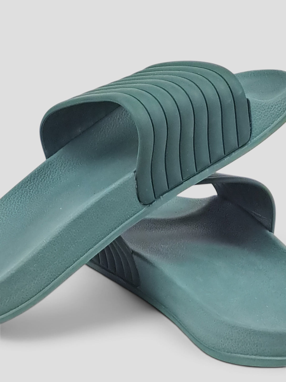 BaraBarnet green slides with a wide ribbed strap and contoured footbed in a simple matte finish
