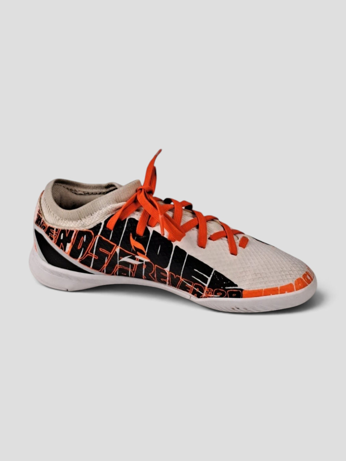 BaraBarnet adidas indoor soccer shoes in white with black graphic print and bright orange laces for agility.