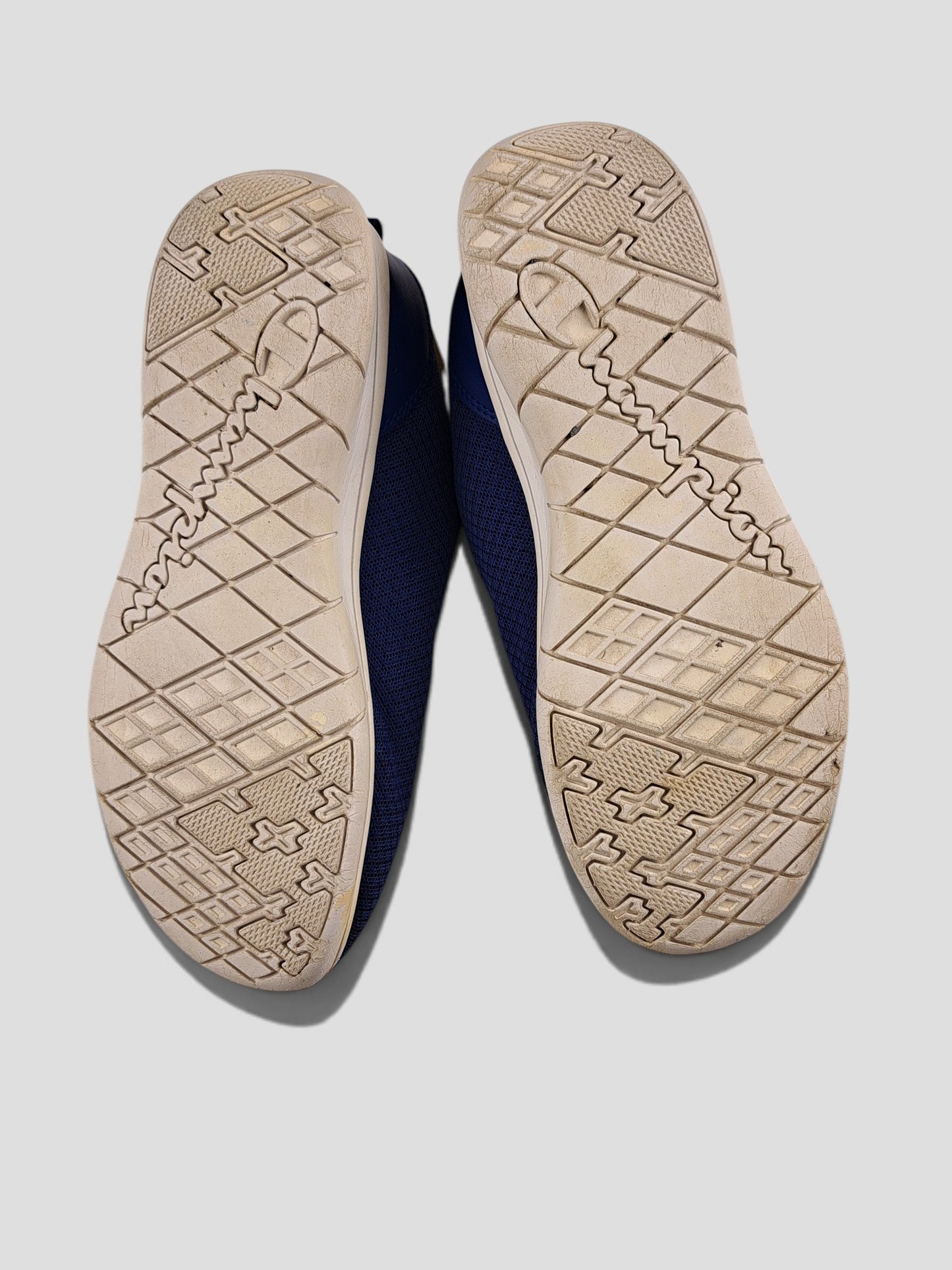 BaraBarnet Champion blue sneakers showing the textured rubber outsoles with brand logo detailing