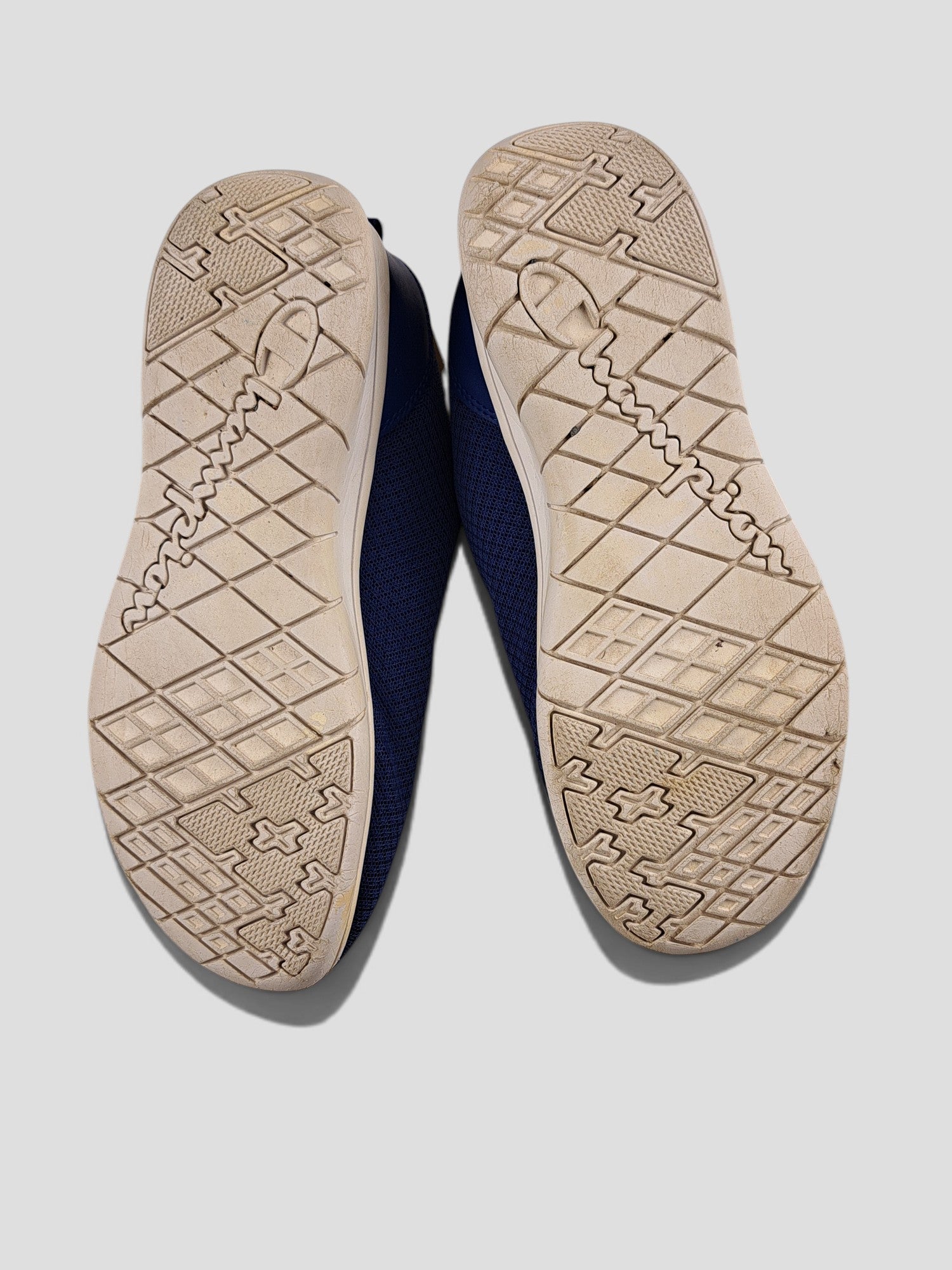 BaraBarnet Champion blue sneakers showing the textured rubber outsoles with brand logo detailing