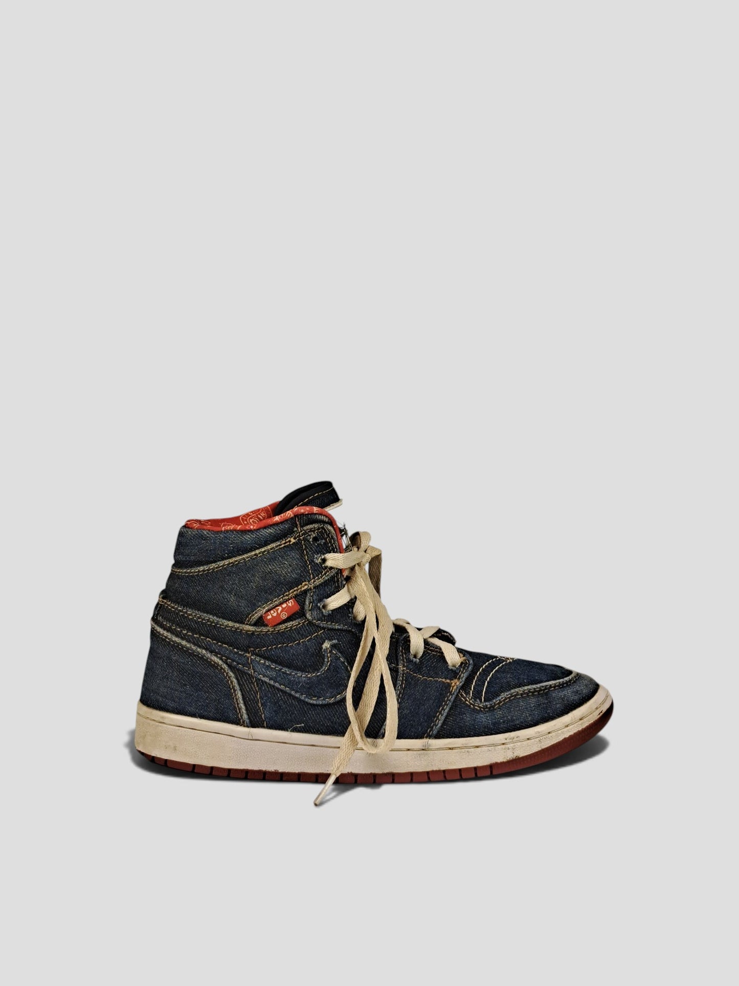 BaraBarnet Levi's x Nike high-top sneakers in dark blue denim with red paisley lining and cream laces