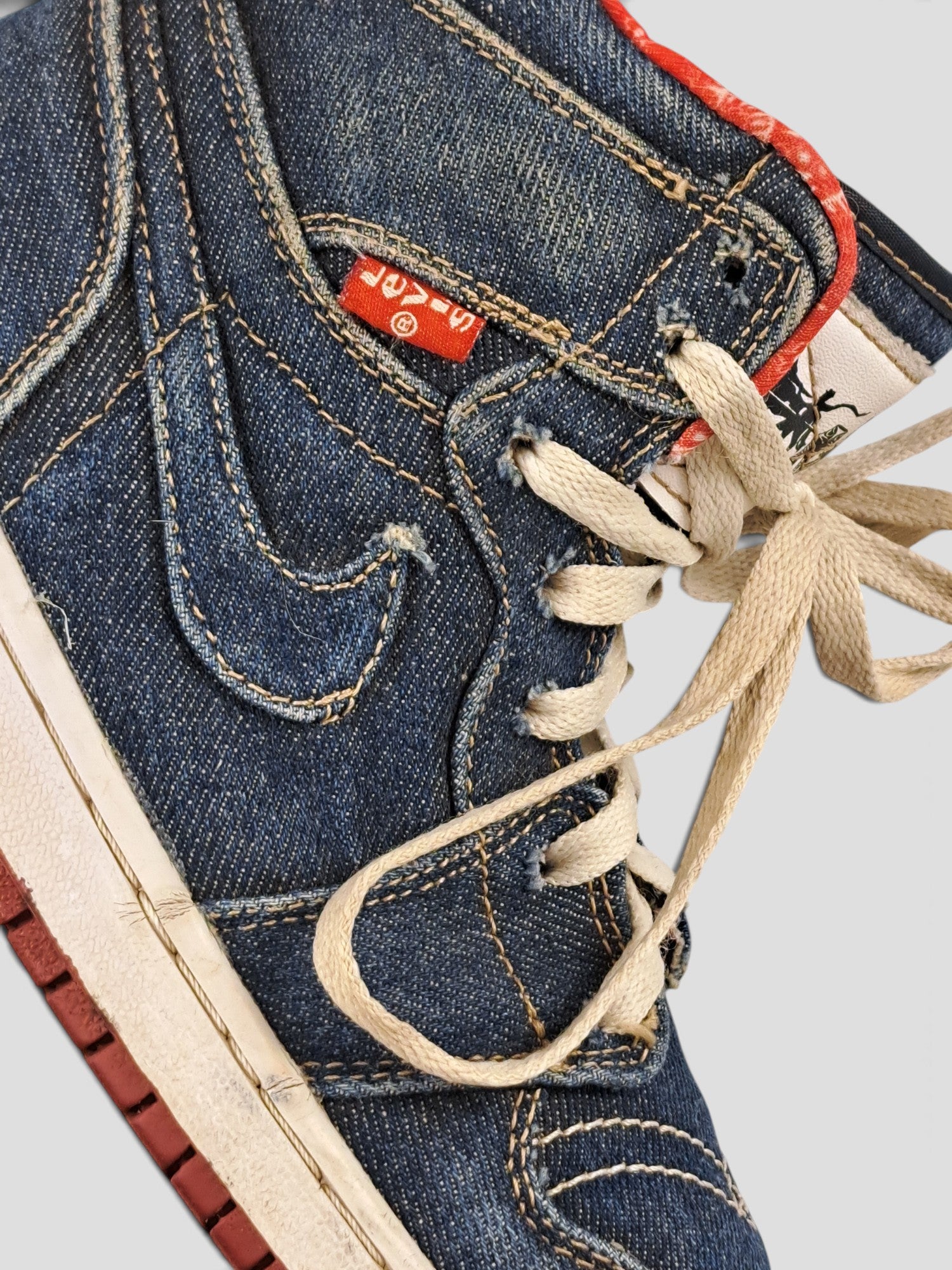 BaraBarnet Levi's x Nike high-top sneakers in blue denim with red accents and white laces
