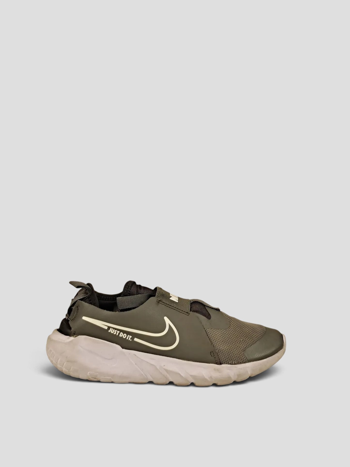 BaraBarnet Nike olive green slip-on sneakers with white Just Do It swoosh logo and thick white cushioned sole