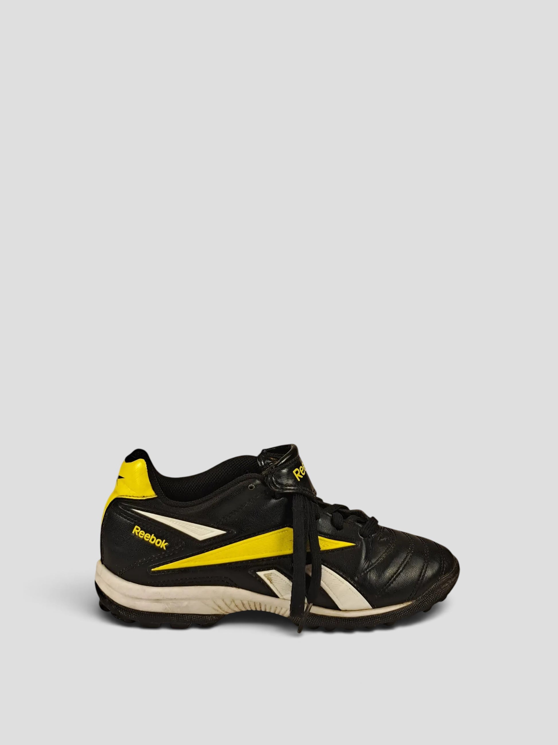 BaraBarnet Reebok black and yellow athletic sneakers with white logo detailing and lace-up closure