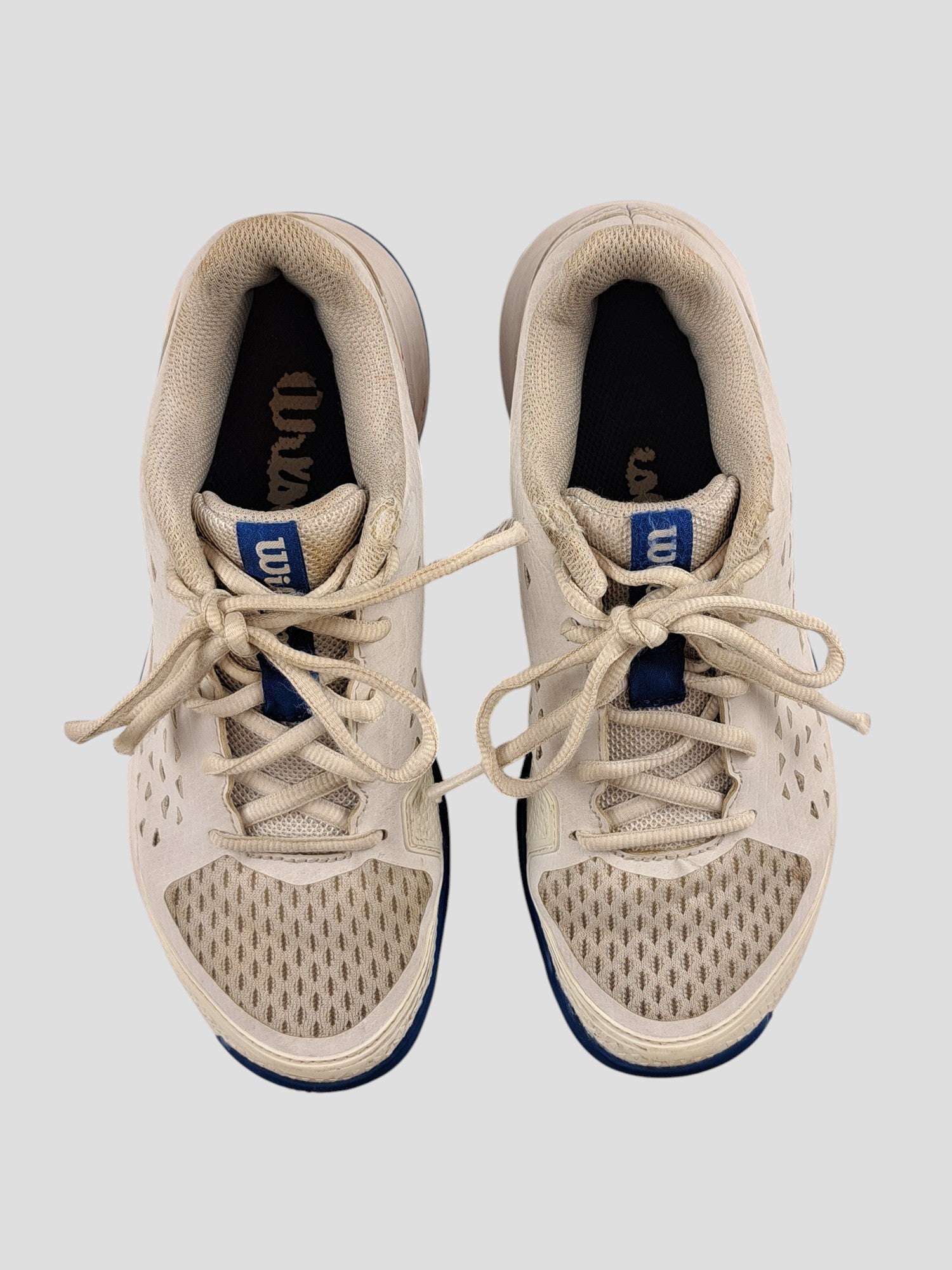 BaraBarnet Wilson RushPro 36 white tennis shoes with blue accents and mesh detailing viewed from above